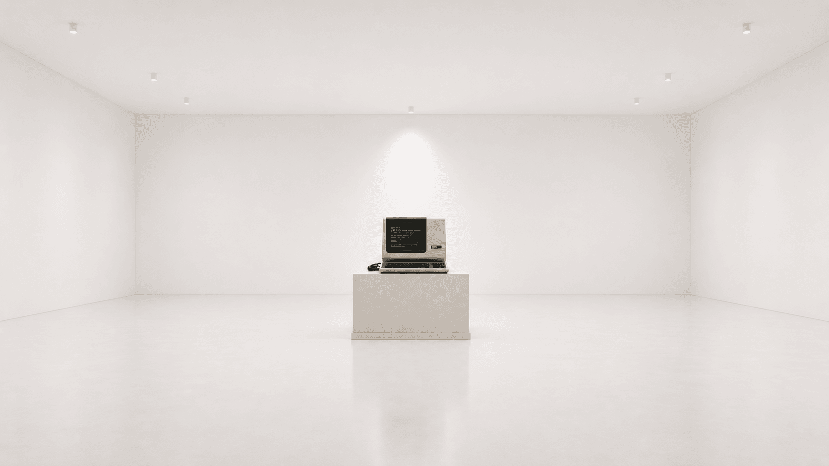 A vintage micro-computer alone in a gallery room