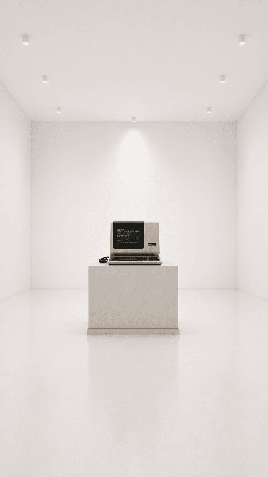 A vintage micro-computer on a plinth